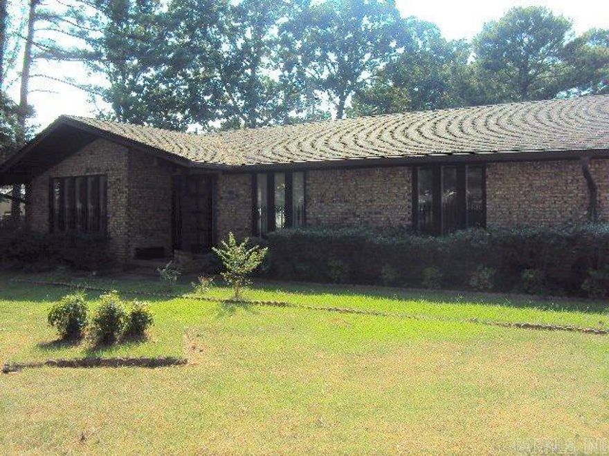 Want your own backyard oasis? Buy this one & fix it to your taste. Hot tub, gazebo, boat dock, covered deck out back. Sprinkler system from lake. Home has been vacant and needs Tlc, but has lots of potential. There are 3 Br, 2 Ba, formal LR and DR, or bonus rms if you wish. Another rm features built-in desk/counter, plus laundry rm, Greatrm w/gas log Fp. Stg/workshop rms off the garage, plus fish in the lake, refurbish the koi pond. There are endless possibilities with this one (AGENTS SEE REMARKS)