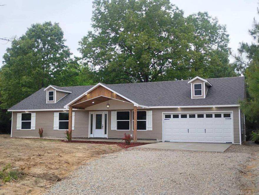 Welcome to your serene home just out of Pocahontas located on 2 acres M/L. Featuring a covered front porch with rustic wooden accents, this newly constructed 3BR/2BA residence boasts inviting curb appeal with a location that cannot be beat. Inside you will find an open concept layout with ample natural light, and vaulted ceilings in the main living and kitchen areas complete with ample accent lighting . Beautiful granite countertops compliment the white cabinets. The master suite features a large bathroom with tiled shower walls and a walk in closet. Out the back of the home you will find a deck, perfect for family gatherings!  The attached two car garage provides for plenty of storage and with approximately 2 acres, there is plenty to do outside as well. Located on a paved road close to the country club, hospital and more.