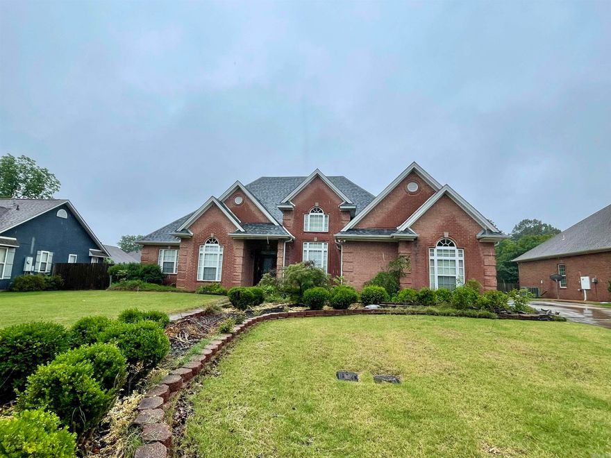 1013 Brownstone Dr. in Jonesboro, Arkansas is a 3 bedroom, 2.5 bath home on a beautiful landscaped lot. The primary suite is large with a walk-in shower, separate tub, two closets, and a safe room. There is also an office, separate formal dining room, hardwood flooring with mahogany inlay, 10-11ft ceilings, abundant storage, and a sprinkler system. A new roof was installed in 2024 and there are 2 HVAC systems, one outside unit was replaced in approx. 2020 and the other in 2025. You'll love all that this home has to offer! Call your favorite REALTOR® and schedule your private tour.