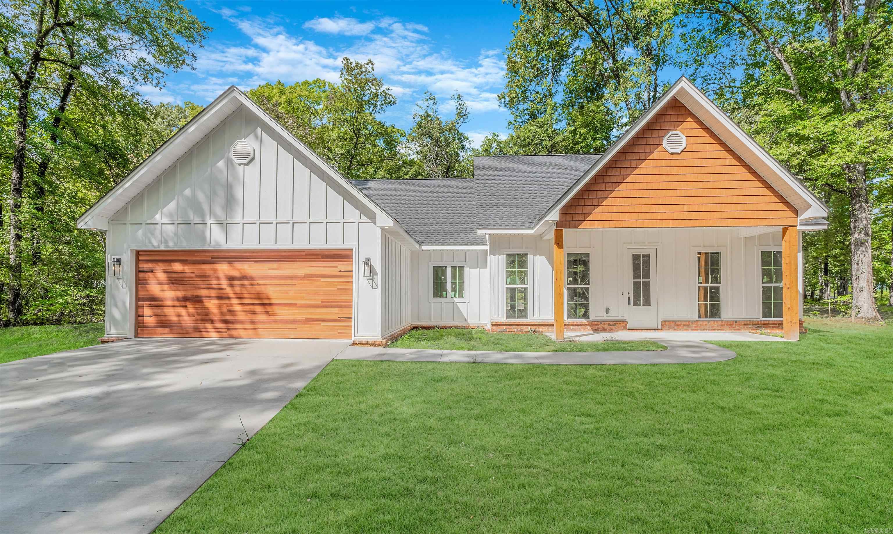 BEAUTIFUL NEW CONSTRUCTION on a 1 acre lot with 3 bedrooms and 2 bathrooms, boasting an open floor plan with tall ceilings, gorgeous granite counters throughout, custom wood cabinets with kitchen island, large walk-in pantry with cabinets and room for a freezer or extra storage, desk, etc., extra tall front and back doors, garage entry hall tree cabinet/bench storage, master bedroom is separate with tub, walk-in tiled shower, and walk-in closet, large covered back porch, nice trees and more secluded than a big subdivision. Schedule your showing today, you may qualify for $0 down with rural development loan!