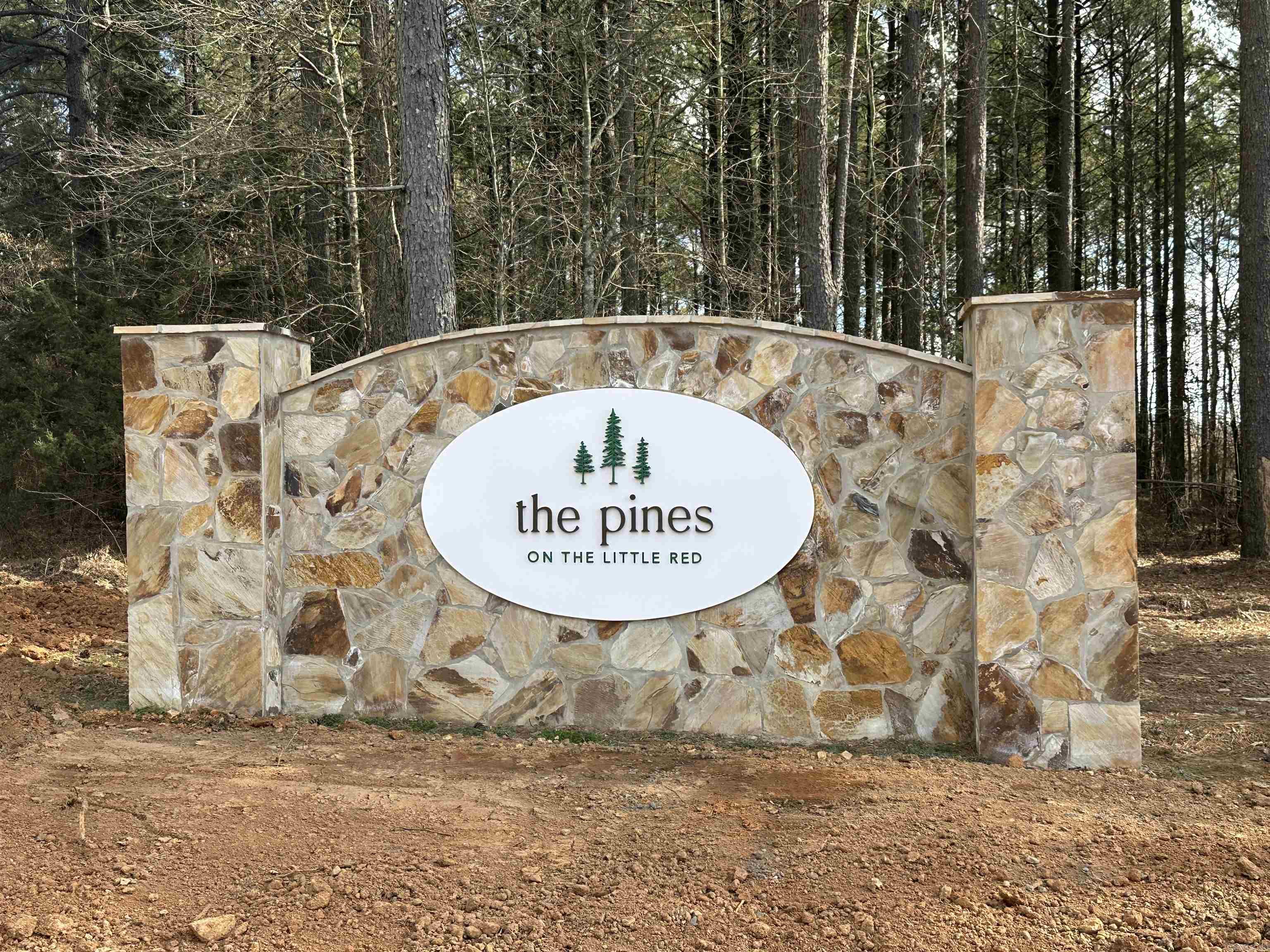 Lot #4 in The Pines on The Little Red. (Riverfront lot.) The Little Red River's newest, premier riverfront property just 3 miles from Pangburn. World class trout fishing right outside your back door! This stretch of the Little Red River is known for both quality and quantity of trout. There are numerous rainbow trout and brown trout that call this stretch of the river home. This property boasts access to your own private, gated boat launch. Located 3.2 miles upstream from the Ramsey's Access, and 2.6 miles downstream from the Dripping Springs Access. Lot #4. See map. If you know, the Little Red River is home to many aquatic species, and also many other species unique to a tailwater ecosystem. If you don't know, it's not uncommon to see bald eagles, river otters, whitetail deer, turkey, and a multitude of migrating waterfowl. There are many resident Canada geese and wood ducks too! It's truly a sportsman's paradise. This riverfront property is tucked away and protected by large, mature pine trees on the north side, and the Little Red River on the south side. You even have a beautiful view of Round Mountain across the river to the east.