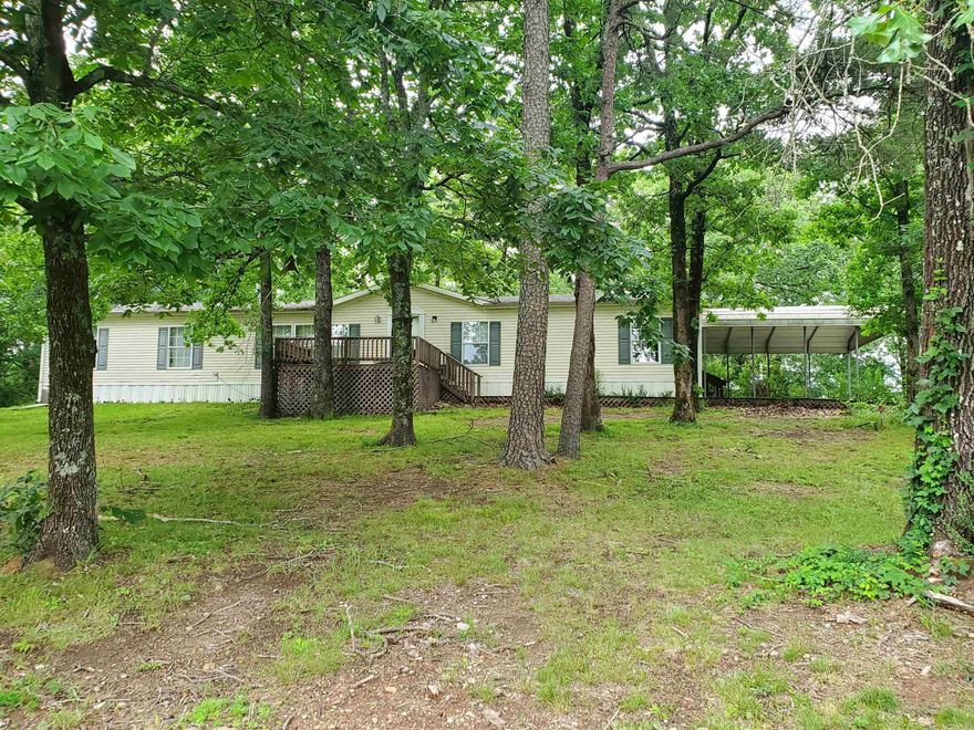 Country living with income potential.  Two homes on 15.13 Acres with Mountain Views. Spacious 3 bedroom, 2 bath doublewide home on beautiful acreage featuring pasture and hay meadow land. This home offers large rooms throughout, a cozy living room with fireplace, separate den, breakfast room, and formal dining room, great for entertaining. A newer HVAC system adds comfort and efficiency. Enjoy peaceful outdoor living with a double carport, large deck overlooking a scenic pond, and stunning mountain views. Located close to ATV trails for outdoor adventure right nearby. The property also includes a separate 3 bedroom, 1 bath frame home (freshly remodeled), ideal for a guest house, rental income, or multi-generational living. A rare opportunity for country living, recreation, and investment potential all in one property.
