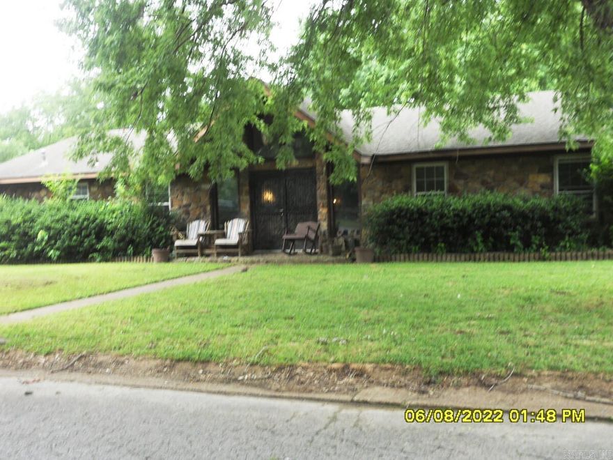 Unique custom built, 1 family owner home situated on corner lot. Rock and vinyl. This home is a split bedroom design and has a unique floor plan being that the family room & master bedroom area is of a sunken style as popular in the mid- 70's, the remaining portion of house is 1 step up from the other areas. The house has dark panel/wall paper, parquet, carpet and vinyl flooring, again, as popular in the 70's. All the carpet will need to be updated and possibly the vinyl depending on buyer preferences. Some other updates paint and lighting will truly brighten and lighten this house up. The CH&A, Roof & Windows/ utility and den sliding door are all updated in last 5-8 years. Small double or oversize single carport with large carport storage room. The generous size back yard is fenced with a storm cellar in rear that as access from inside living area. The storm cellar is sealed, it stays dry with no leaks. This home has 3 or 4 bedrooms the 4th is adjacent to (and access from) the North East/front) bedroom so it could be play/media room or even an office. There are 3 bathrooms, 2 (have stand alone showers) each adjoin/access the north side bedrooms. One bath has dual entry from bedroo