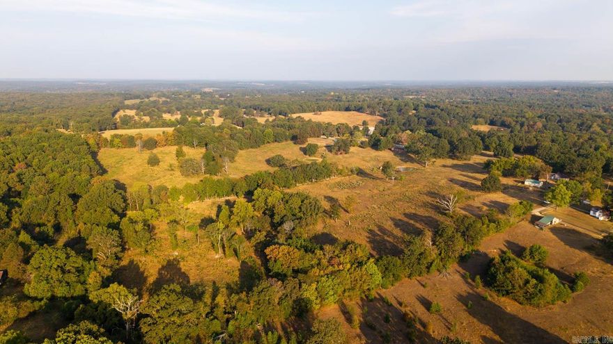 Acreage, Pasture, and Woods – 32 Acres with Prime Potential  Welcome to this 32-acre property located just outside the city limits, offering the perfect blend of rural living with the convenience of nearby urban access. With city water and rural electric already available, this land is ready for development or for creating your own private retreat. The property features excellent paved road frontage, making it easily accessible and providing strong building site options for your dream home or future investment project.  The acreage presents a balanced mix of open pasture and wooded areas, offering versatility for multiple uses. Over half of the land is open and currently suitable for livestock grazing, with three ponds already in place to provide reliable water sources. The wooded portions not only add character and privacy but also make this a great hunting property, with abundant wildlife and natural cover.  This land is full of opportunity—set up your own farm, hobby farm, or simply enjoy the peace of country living just minutes from town. For developers, the location and layout make this a prime opportunity for future growth or subdivision potential. Outdoor enthusiasts will lo