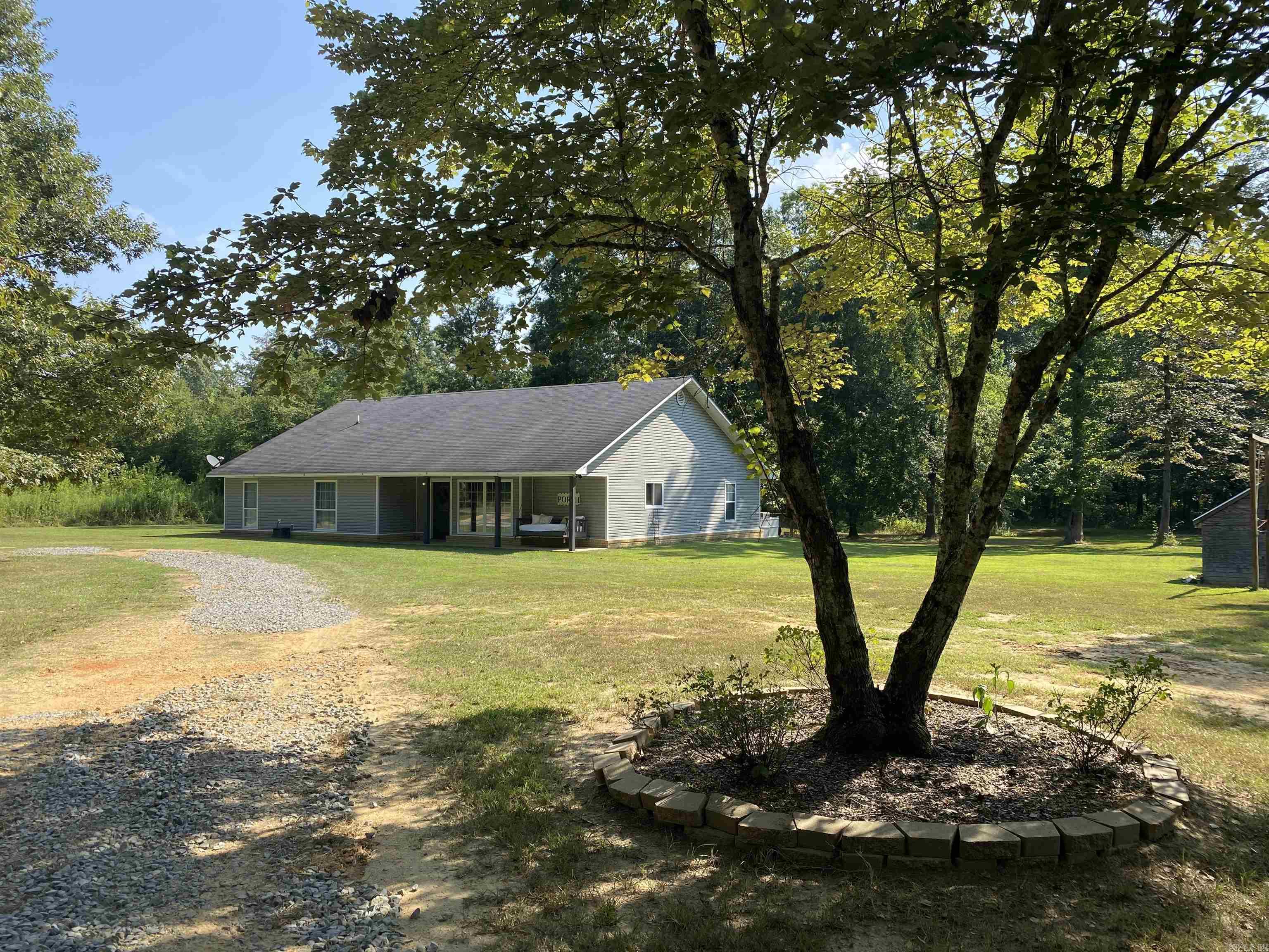 Charming 3 bed / 2 bath / 1,988 sqft home on 10 acres in peaceful country setting. This well-maintained property features spacious living area open to kitchen and dining area. Double wall oven, ceramic cooktop stove, ample counter space and island with prep sink make for convenient cooking and enjoyment. Primary bathroom has large walk-in shower with dual shower heads, his/her vanities and jetted garden tub. This is truly a place to live and grow. Located just minutes from Hamburg, this home offers quiet living with convenience. All electric, 2 HWH (2023 & 2007), Central HVAC 2016, Roof 2007