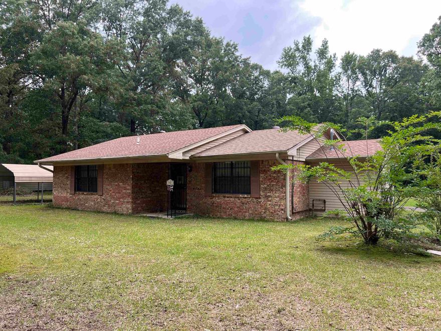 Welcome to this clean and well-maintained 3-bedroom, 1-bath brick home nestled on 3.86 acres of peaceful countryside. This charming residence offers a comfortable layout with a nice-sized living room, a functional and attractive kitchen, and generously sized bedrooms featuring ample closet space. Enjoy the convenience of a dedicated laundry room, a covered carport with an attached storage room, and an additional storage shed for all your tools and equipment. The partially fenced-in yard provides plenty of room for pets, gardening, or outdoor entertaining. Whether you're looking for space, privacy, or the charm of country living, this property offers it all with room to grow.