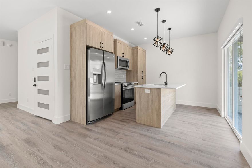 This stunning second-floor apartment in the heart of SOMA is brand new and almost ready for you! Built in 2024, this modern gem is putting on the finishing touches and will be move-in ready by August 1st. Get ready to be wowed by sleek quartz countertops in the kitchen and bathrooms, stainless steel appliances, and an in-unit washer and dryer for ultimate convenience. But wait, there's more! This apartment boasts a private 1-car garage and additional off-street parking, a rare find in downtown. Plus, unwind and take in the city views from your own private, large rooftop patio – perfect for entertaining friends or enjoying a cup of coffee under the morning sky!