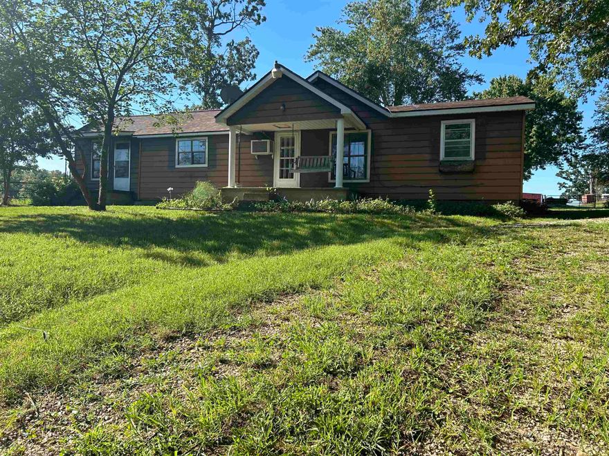 Rural living with no neighbors but still on a main highway. Located half-way between Viola & Salem, Arkansas. This home has had some updates such as a new roof in 2022, new vinyl flooring throughout, new kitchen cabinets, new dishwasher and sink, new bathroom fixtures and paint throughout.  It has a spacious eat-in kitchen/dining area and large living room. Spacious utility room with washer/dryer hookups & elec water heater. Three covered porches, one with a porch swing to enjoy these cool mornings with a cup of coffee. Large yard with beautiful shade trees and ornamentals. Yard is partially fenced. Also comes with a large shed/work shop. Private well and septic system. Electric & highspeed internet serviced by North Arkansas Elec Coop.