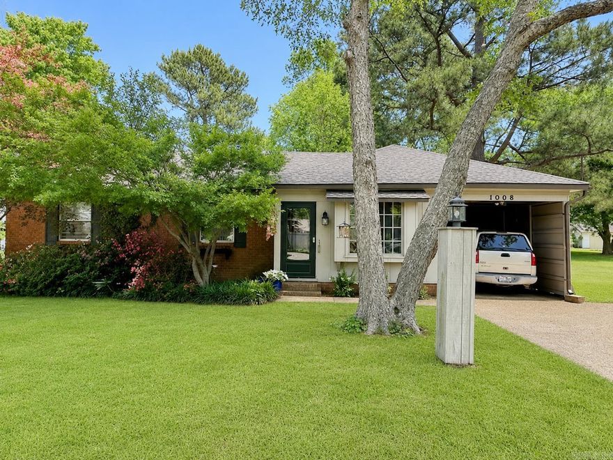 Charming cottage-style traditional home in the heart of Corning! This 3 bedroom, 1.5 bath home is full of character and timeless appeal. Enjoy relaxing mornings in the glass-enclosed front porch that connects the carport to the front entrance, plus a back patio and covered back porch with the potential to easily be screened in for additional outdoor living space. Inside, you'll love the charming details throughout, including beautiful green kitchen cabinets & matching cabinets in separate butlers pantry.  Refrigerator and washer & dryer stay. Lovely wallpaper accents in the separate dining room, and wallpaper with matching bedspread in the primary bedroom. A spacious cedar-lined closet in hallway provides excellent additional storage. The vacant lot next door also conveys with the property previously home to a residence, with utilities already available offering endless possibilities for expansion, gardening, or additional outdoor space. A warm and inviting property with cottage charm inside and out!