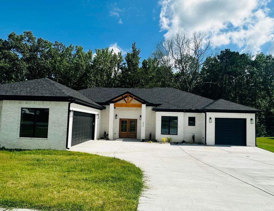 Welcome home to this stunning new construction! This thoughtfully designed home features 3 spacious bedrooms, a dedicated office, and 2.5 beautifully appointed bathrooms. Step into the expansive living room that flows seamlessly into the open-concept kitchen and dining area—perfect for both everyday living and entertaining.  The kitchen is a chef’s dream, complete with granite countertops, premium finishes, and plenty of prep space. Luxury vinyl plank flooring runs throughout the main living areas, adding both style and durability.  Enjoy outdoor living with a large covered patio featuring a cozy fireplace—ideal for relaxing evenings. The primary suite is a true retreat with a generous bedroom, massive walk-in shower, and modern finishes.  Don’t miss your chance to own this exceptional home!