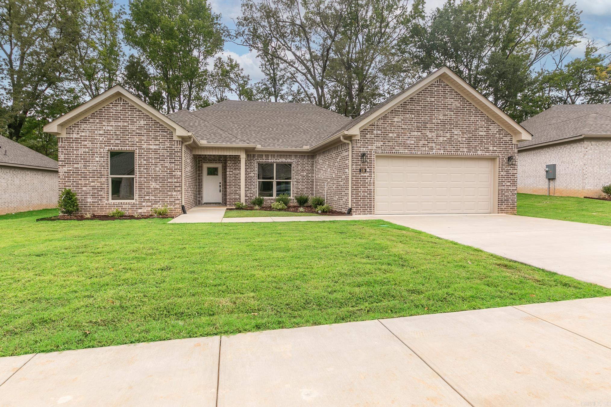 Welcome to Carmel Oaks, one of Cabot's newest communities, only 12 miles from the Little Rock Air Force Base. This NEW construction floor plan offers 3-bedrooms and 2-bathrooms. As you enter, youāre greeted by tall ceilings, a cozy fireplace, crown molding, and an open floor plan that seamlessly connects the living, dining, and kitchen areas. The MASSIVE living area features natural light and a seamless flow into the designated dining area with a great view of the covered back patio! This home utilizes SOLAR board roof decking for energy efficiency. Other features include: floored attic space for ample storage, 42" custom kitchen cabinet upgrades, granite countertops, custom kitchen pantry with a receptacle for your coffee station, LVP flooring, tiled shower in the master bathroom, comfort height toilets, large custom walk-in master closet, 50 gallon water heater, recessed lighting AND ceiling fans, elegant finishes and neutral tones to enhance versatility. This property is also equipped with an irrigation system. Located in highly sought after Cabot School District. Several new-homes and floor plans to choose from! (Photos may not show exact finishes of this address.)