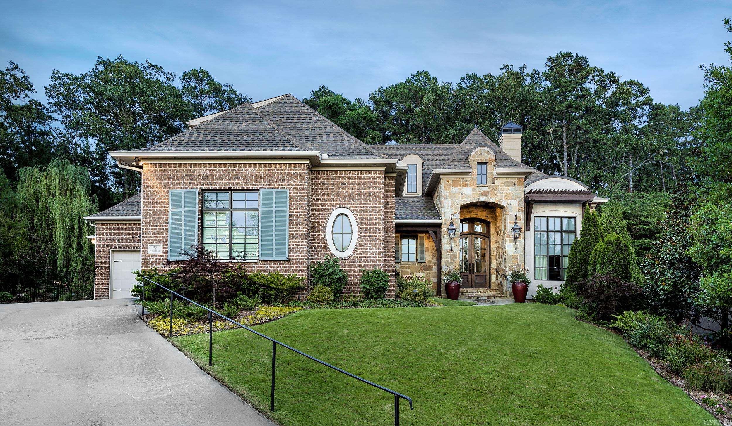 Timeless masterpiece! This custom home is located behind the gates in Chenal Valley's "The Arbors" neighborhood. This 4 BR/3.5 BA is tucked into a private cul-de-sac lot with extensive landscaping and privacy. You will enjoy the very best in quality and comfort design in this classic home. This fabulously designed home is set off with a stunning entry, an inviting home office/study with new electric fireplace and beautiful windows, the wonderful living space with beamed ceiling overlooking the private backyard and patio is a must see. The elegant dining room sits adjacent to the gourmet kitchen. The primary suite is a wonderful escape. The new owner will enjoy the primary suite on the main level along with an additional spacious guest en-suite. The screened terrace with new grill and fireplace is a great place for entertaining. Upstairs: 2 BR, 1 BA, walk out attic storage. All TV's remain. Call for gate code.
