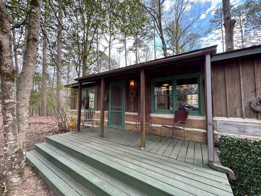 One of those Rare times in life a great cabin near Ouachita comes along. This one is minutes from Shangri-La resort with popular restaurant & marina, Ouachita Vista Trail & Denby Bay trailhead access. This place has never sold on the open market and has been in the family for generations. Under roof is 1986sqft consisting of 2 cabins(2 bed/1bath w/ full kitchen & 1bed/1bath w/ kitchen stub out) connected by screened porch breezeway, carport/patio & porch. Newer stove, water heater, mini-splits, refrigerator, deck, paint, plumbing and electrical upgrades. Out building for extra storage. Ample space to park boats & store lake toys in the off season. It would likely be possible to have RV parking as well. Vacation Rental income option. Updated for today's comforts. Tranquil cabin in the woods for a place to drop your bags and enjoy all that Ouachita offers or call it your main home. Surveillance system does not convey but absolute solitude is included.