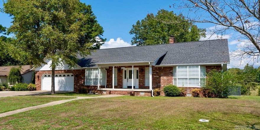 Beautifully remodeled in 2021, this spacious 4-bedroom, 2.5-bath home offers comfort, style, and convenience. The living room boasts vaulted ceilings, a wood-burning fireplace, and stylish built-in shelving. Interior updates include fresh paint, new flooring throughout, and a 2022 HVAC system. The kitchen features stainless steel appliances, granite countertops, and refreshed cabinets with shaker-style doors and modern hardware. Enjoy the expansive primary suite with french doors opening to the back deck, primary bath offers a walk-in closet, double vanity, soaking tub, and a walk-in tile shower. Step outside to a large wraparound deck overlooking peaceful pastureland. With a garage big enough for lake toys and an extra parking pad, there's plenty of space for all your gear. Ideally located near shopping, restaurants, and Greers Ferry Lake access.