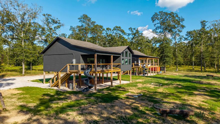 Two New Homes on 5.9 acres and 1,578 feet of frontage! Perfect for short term rentals or a family retreat, this property features two brand new homes with covered decks overlooking the beautiful Mazarn. Enjoy outdoor fun with a slide for kids (and kids at heart), a cozy fire pit area, and room to build more. Endless potential for investment or relaxation!