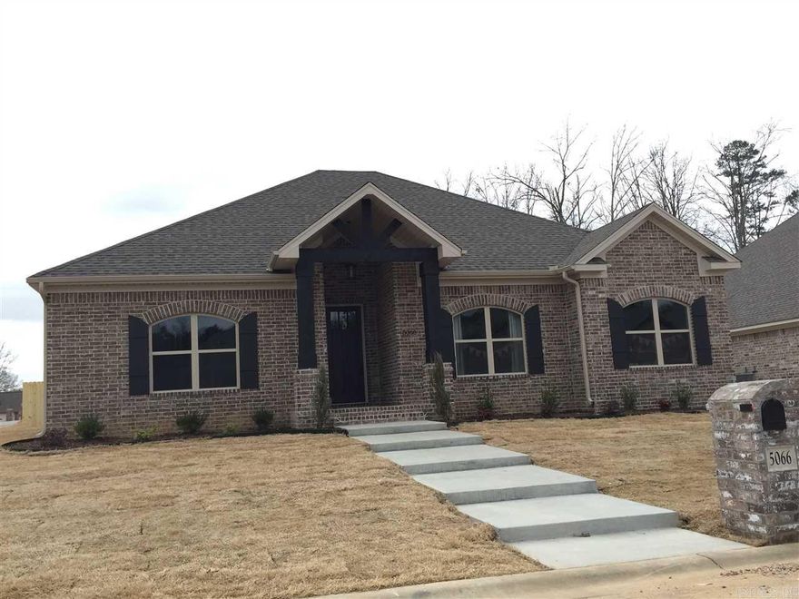 Beautiful 100% brick home .4 bedroom 2 bath and a bonus room. Open concept with large kitchen island, granite tops throughout, hand scraped laminate flooring in main living areas. Large windows across back of house, so a ton on natural light! Large covered back porch. Corner lot with side loading garage.