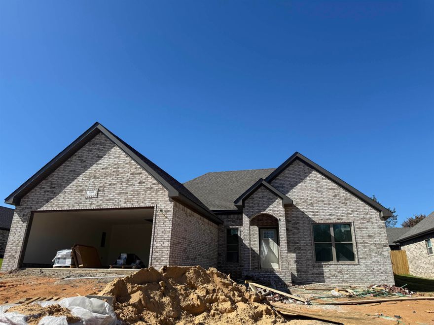 Looking for a three bedroom home with maintenance free exterior all brick, all one level open concept plan, split bedrooms allowing privacy for the primary suite and guest rooms sharing a hall bath. The Island kitchen and quartz counter tops are sure to wow the new home owners. The primary suite offers two sinks, a separate shower and a free standing tub, natural light pours in from the frosted window above the tub allowing for a luxury style bath in this comfortable home. Call today and pick out some of the finishes in this beautiful new construction home.