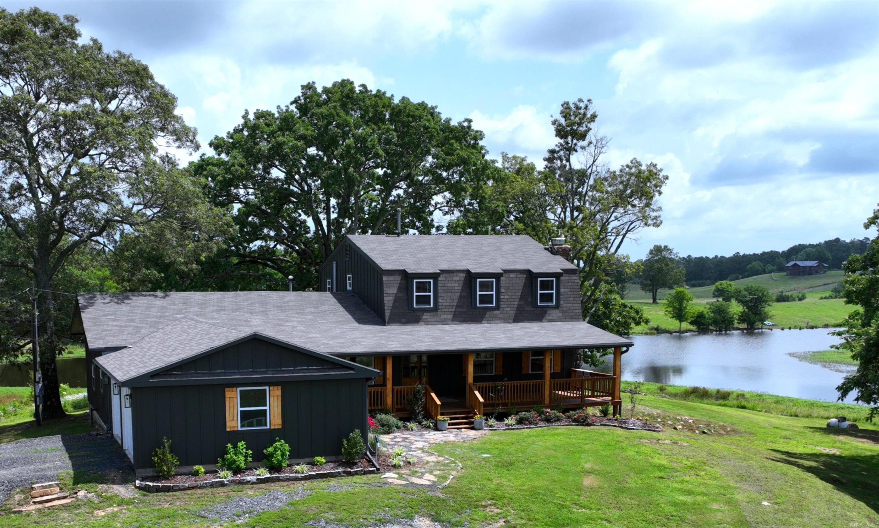 Absolutely Awesome 37.44 acre turnkey hobby farm delights the senses in every way. The 4 bedroom, 3 1/2 bath two story ranch house stands majestically atop a hillside offering serene views of the surrounding mountains, a wide-reaching pond, pristine pastures, and forested plots. There are barns, loafing sheds. a shop with power and water, and other outbuildings. AND THERE IS MORE! This property is located 1/4 mile from the National Forest and one of the top-rated Wolf Pen Gap trailheads for ATVs. The thousands of acres of National Forest also provide hunting availability and equestrian opportunities. This area is AirB&B heaven! The home has been completely remodeled inside and out. New roof, new siding, new deck, new porch, new flower beds & landscaping, and new garage doors are a part of the renovations, but the inside is remarkable. New Everything! Only the rock fireplace and stone sunroom remain, reflecting the rich history of the area. Watch the video, slideshow, and 3D tour to appreciate the meticulous care taken to elevate this place to levels of the gold standard. Stunning!