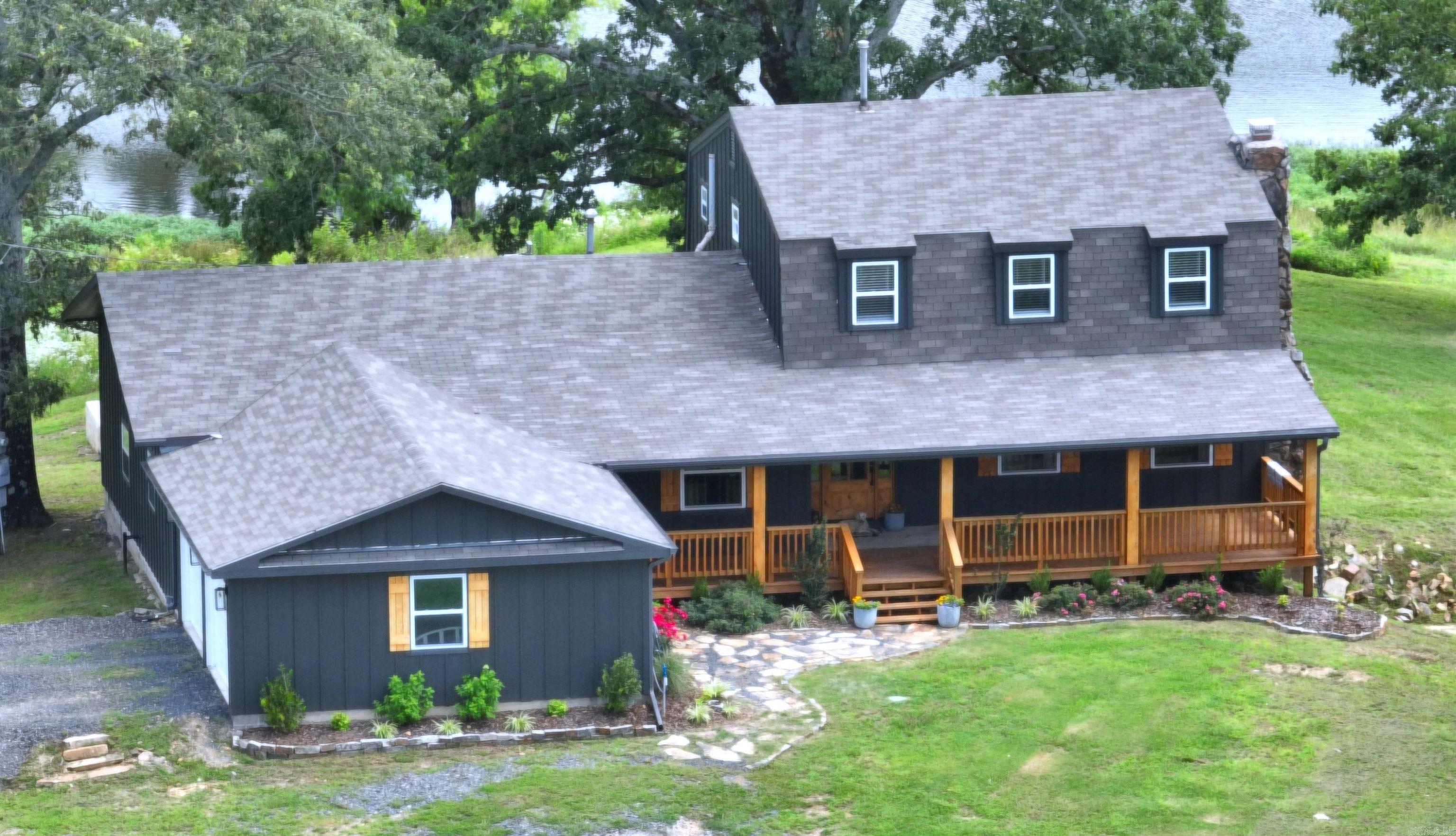 Absolutely Awesome 37.44 acre turnkey hobby farm delights the senses in every way. The 4 bedroom, 3 1/2 bath two story ranch house stands majestically atop a hillside offering serene views of the surrounding mountains, a wide-reaching pond, pristine pastures, and forested plots. There are barns, loafing sheds. a shop with power and water, and other outbuildings. AND THERE IS MORE! This property is located 1/4 mile from the National Forest and one of the top-rated Wolf Pen Gap trailheads for ATVs. The thousands of acres of National Forest also provide hunting availability and equestrian opportunities. This area is AirB&B heaven! The home has been completely remodeled inside and out. New roof, new siding, new deck, new porch, new flower beds & landscaping, and new garage doors are a part of the renovations, but the inside is remarkable. New Everything! Only the rock fireplace and stone sunroom remain, reflecting the rich history of the area. Watch the video, slideshow, and 3D tour to appreciate the meticulous care taken to elevate this place to levels of the gold standard. Stunning!