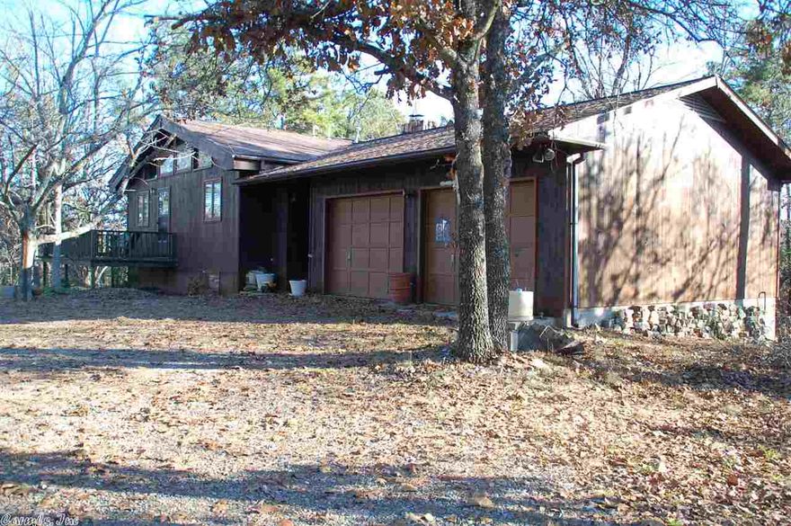 Very private wooded setting.  Unique country home nestled on a small mountain top.  Relaxing on the deck offers views of beautiful sun sets or watch the distant twinkling lights of Mena at might.  Lots of windows to watch the wildlife in the woods. Quiet end-of-road location where you can hear the turkey and hawks. Includes a guest house and additional detached garage in addition to 2-car attached garage.