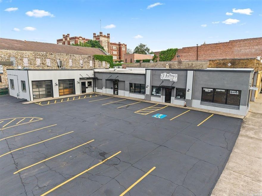 Excellent commercial opportunity in the heart of downtown Hot Springs. Located at 1001 Central Avenue, this 3,915 square foot building offers great visibility, easy access, and a feature that is extremely hard to find downtown—14 dedicated parking spaces. With frontage directly on Central Avenue, this property sits in one of Hot Springs’ busiest commercial and tourism areas with steady traffic from both locals and visitors.  The building is currently divided into two separate commercial spaces, giving a new owner plenty of flexibility depending on their business needs. Inside you will find two commercial kitchen areas, four total restrooms, and separate utility systems for each side including central heat and air, alarm systems, hot water tanks, and more. The setup makes the building functional for a wide range of commercial uses including restaurant, retail, office, service, or hospitality.  Its downtown location puts it close to shopping, dining, Bathhouse Row, Oaklawn, and close to the new hotel currently being built on Central Avenue. Properties in downtown Hot Springs with this amount of square footage, onsite parking, and versatile commercial space do not come available often