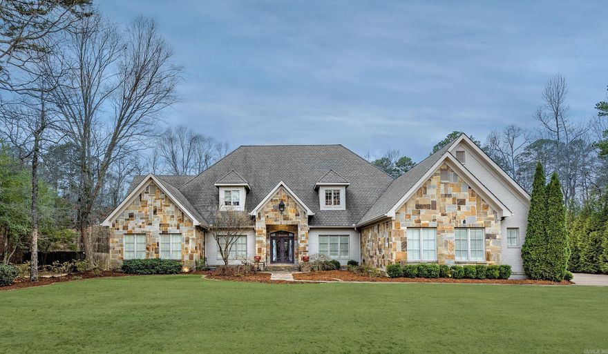 Stunning Home in Prestigious Chenal Neighborhood!  This beautifully designed home features 4 bedrooms and 3 full baths on the main level, plus a bonus room, full bath, and entertainment room upstairs—perfect for movie nights or a game room setup. The spacious layout offers comfort and flexibility for everyday living or hosting.  Step outside to your private backyard retreat complete with a large in-ground pool, freestanding stone fireplace, outdoor kitchen, and covered patio—ideal for relaxing or entertaining year-round.  The oversized primary suite boasts an updated spa-like bath and generous walk-in closet. Located on a quiet street in one of Chenal’s most desirable areas, this home offers both luxury and livability.  Don't miss your chance to see this incredible property—schedule your private tour today!