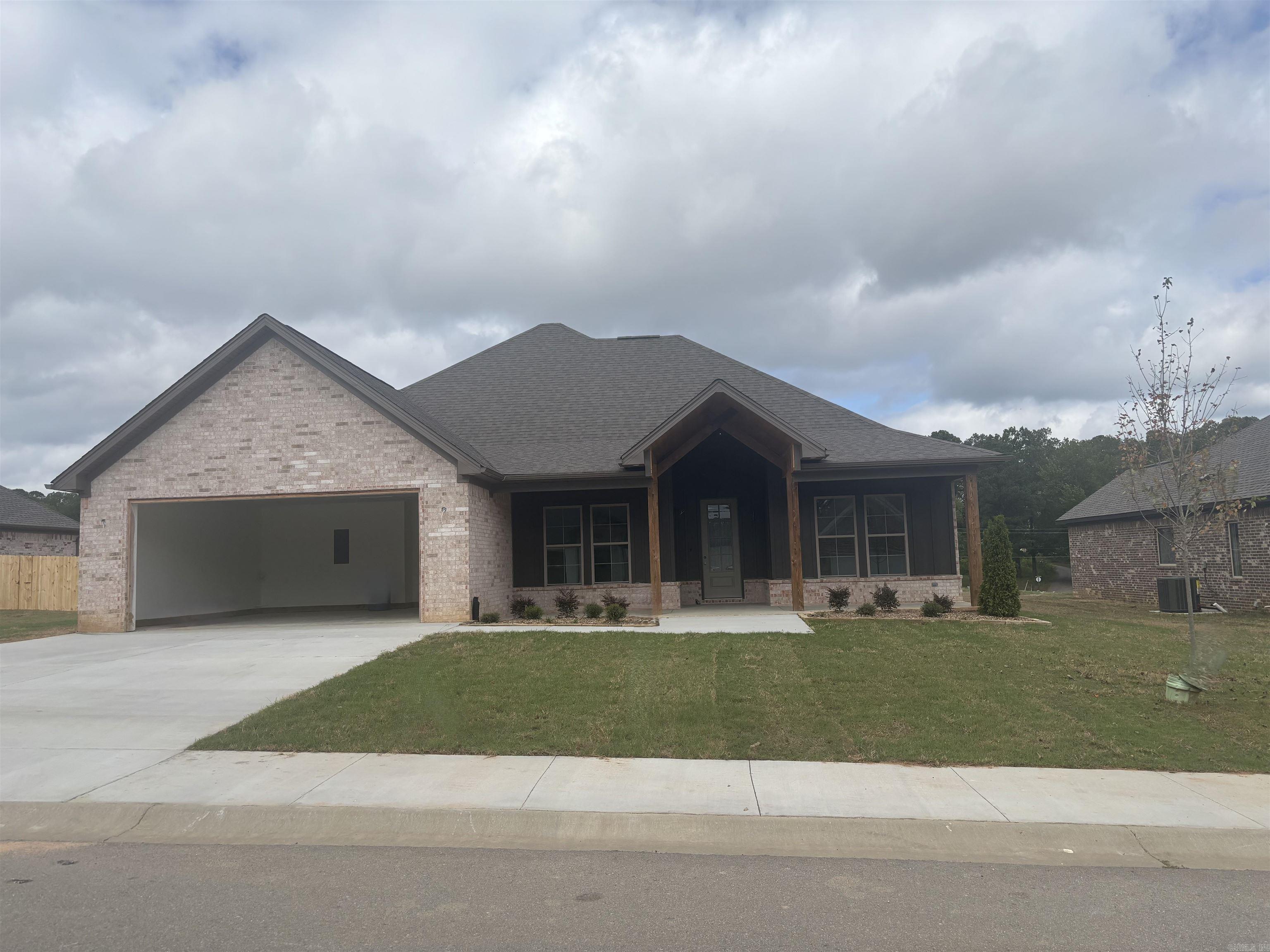 . Has extra landscaping, large covered back porch. Entry has 12 ft ceilings, Kitchen has walk in pantry with gas cooktop and wall oven, with large island over looking great room. Master has custom ceiling. Master bath has large tile shower. Homes has LVP flooring throughout.