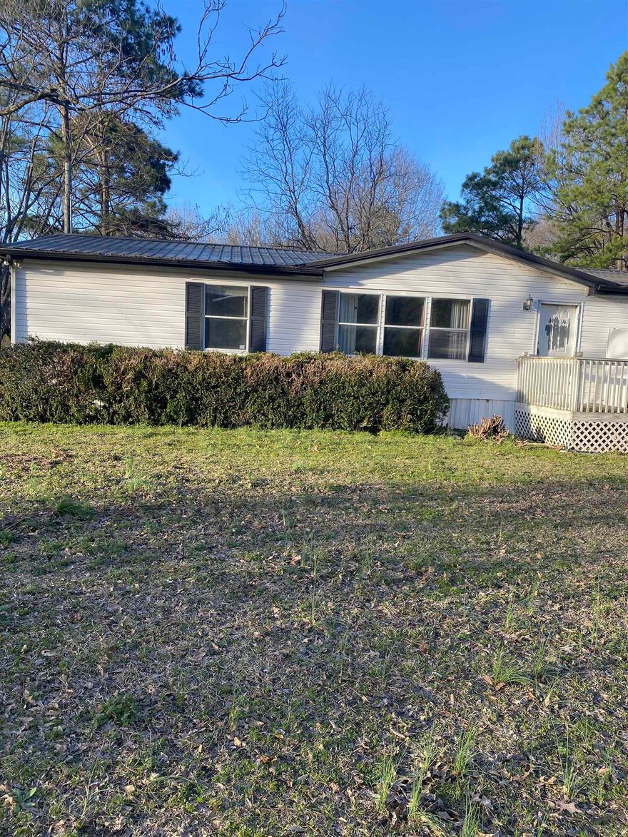 Beautiful private 4.61 acres nestled at the end of a dead-end road, minutes from Hwy 67/167. This property has a big a pasture, next to a pond equipped with walk out dock for that late night fishing This site also features a huge shop, that is wired and has a loft!  This 3/2 mobile could be your dream home, go see it today it will not last!  Has had good rental history for last 5 years. So No SPD.  see agent remarks SQFT APPROX MEASUING ENCOURAGED