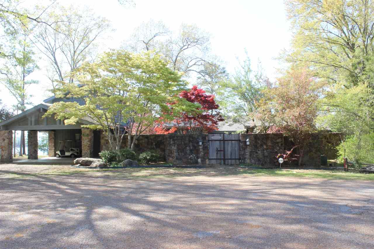 Eden Isle - LAKEFRONT, FURNISHED home with great privacy, an incredible location and spectacular lake views and lake access!! Located at the northernmost end of Fox Chase Road, this home would be fantastic for a large family or a corporate retreat! 6 bedrooms (5 of which are suites with private baths!) spacious living with slate floors, tall ceilings and lots of glass, wonderful front courtyard with great landscaping, 2-car portico & golf cart garage, huge deck, large screened porch, close to EI Marina!