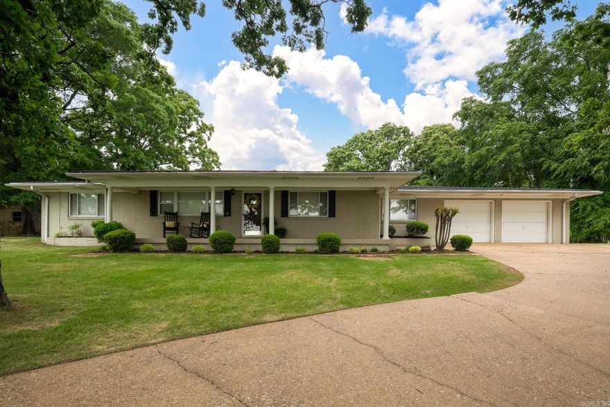 Perched in a prime location overlooking the city of Conway, this 4BR/2BA home has amazing scenic views & timeless character. From the front, enjoy sweeping city vistas, while the back reveals an even more stunning outlook of the large back yard & tranquil view of Lake Gentry—creating a peaceful setting perfect for morning coffee or unwinding in the evening. The front porch invites you inside where the home embraces its original vintage charm, with the opportunity to update & make it your own. The floorplan features a large living room with incredible city views, while the cozy den captures the beautiful lake scenery & access to a covered patio—ideal for relaxing or entertaining. True to its era, the home boasts generously sized rooms & great closet storage throughout. Recent updates include a new roof & hot water heater in 2025. A convenient circle drive enhances both curb appeal & functionality. Step outside to enjoy a nice backyard complete with a shop & shed for hobbies, tools, or extra storage needs. Ideally located, this home is close to dining, shopping, & minutes from the interstate. This property is a unique opportunity to enjoy breathtaking views with endless potential!