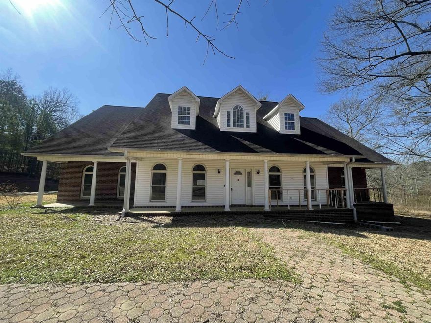 Beautiful two-story brick home that offers luxury and elegance, located down a private driveway for seclusion. This home has plenty of room, along with a 3-car garage, newer flooring, two CH/A units, a gas log fireplace, expansive kitchen with a large island and newer appliances, granite countertops, and chandeliers make this a dream home...not to mention the in-ground pool! Need a game room? This has the perfect space for that as well as an office/study space and even a separate laundry room. The high ceilings that greet you when you enter, along with the natural light from the windows, make the living area extra special. HUD homes are sold "as is." HUD Case #031-582637. www.olympusams-at.com  All offers must be submitted at www.HudHomeStore.gov.