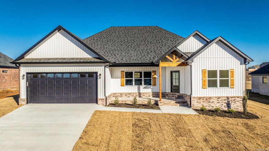 Welcome to this stunning brand new 4 bedroom, 2 bathroom home offering 1,962 sq ft of modern comfort and timeless style. No one has ever lived in this beauty! Step inside to an open concept layout featuring a spacious living area, custom trim accents, and a gorgeous electric fireplace feature wall. The kitchen boasts quartz countertops, stainless appliances, a large island, and floating shelves with under lighting. The split floor plan provides a private primary suite with a spa-like bathroom including a walk-in shower, freestanding tub, and double vanity. Enjoy covered front and back porches, beautiful curb appeal with wood accents, and a large backyard overlooking open fields, perfect for peaceful evenings. This new construction home is move-in ready and located in a desirable area close to schools, shopping, and dining.