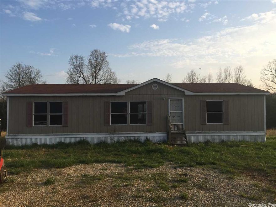 Handy Man's Special!!! Fixer upper Between Ash Flat and Evening Shade on 10 Acres M/L.  Mobile Home has 3 bedrooms and 2 baths and sits on 10 acres with a pond.  Home will need lots of TLC and is sold "AS IS".  Property is mostly cleared with scattered tress and nice pond for fishing. Rural water and septic is already in place.   Property is located about 3/4 of a mile down a dead end gravel Road.  If privacy and quiet is what your looking for then this is the one for you!