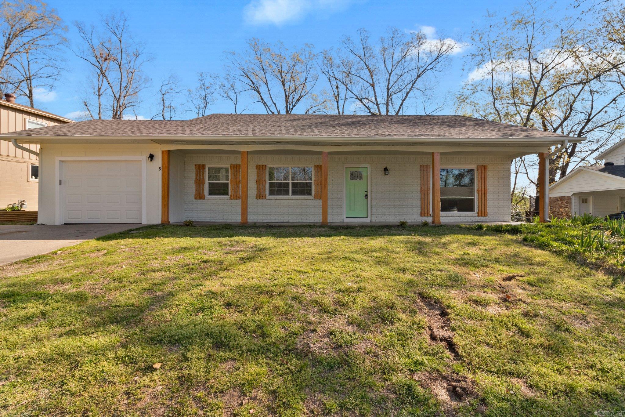 This renovated 4-bedroom, 3-bathroom home spans 2,150 sq ft on a .29-acre lot. Step inside to discover a bright, open-concept layout, sweeping from the living room to the kitchen, featuring granite countertops, a spacious center island, and stainless steel appliances. The lower-level living area offers versatility as a second family room, home theater, or office with a full bathroom. Downstairs also hosts a spacious convenient storage and laundry room. This home blends modern efficiency with timeless style. Outside, enjoy a large backyard complete with a deck and separate storage building, ideal for gatherings or weekend creativity.