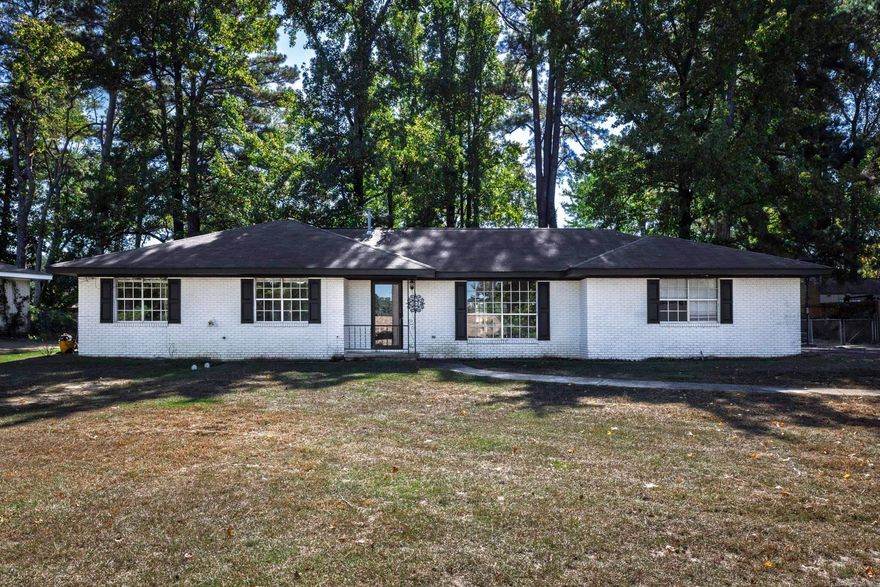 Welcome to this charming 3-bedroom, 2-bath home situated on an oversized lot with a spacious, fenced backyard perfect for outdoor living, pets, or play. Inside, you'll find a versatile living room and dining room combo, along with a cozy den that offers additional space for relaxing or entertaining. The home features beautifully updated bathrooms, including a primary suite with a modern walk-in shower. Extra closet storage throughout ensures plenty of room to stay organized. With a 2-car garage and a comfortable layout, this home offers both convenience and comfort in every detail.