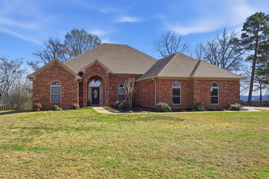 Greenbrier Beauty on Nearly an Acre! This stunning all-brick home offers classic curb appeal, a spacious layout, and quality updates throughout. Step inside to soaring ceilings, abundant natural light, and a blend of luxury vinyl and hand-scraped hardwood flooring that creates warmth and durability. The double-sided fireplace serves as a striking centerpiece, adding cozy charm to both the main living area and the sun-filled sunroom — an ideal space for relaxing, reading, or entertaining guests. The kitchen combines style and function with rich stained cabinetry, granite countertops, double ovens, and a generous pantry. Designed with efficiency and storage in mind, the home includes low-flow plumbing fixtures, added insulation, and extensive floored attic storage. Outside, enjoy the new decking and peaceful views across the nearly one-acre lot, enhanced by mature landscaping and plenty of room to roam. A rare three-car garage adds valuable storage, workspace, and convenience. If you’ve been searching for space, comfort, and timeless style in Greenbrier, this one is a must-see!