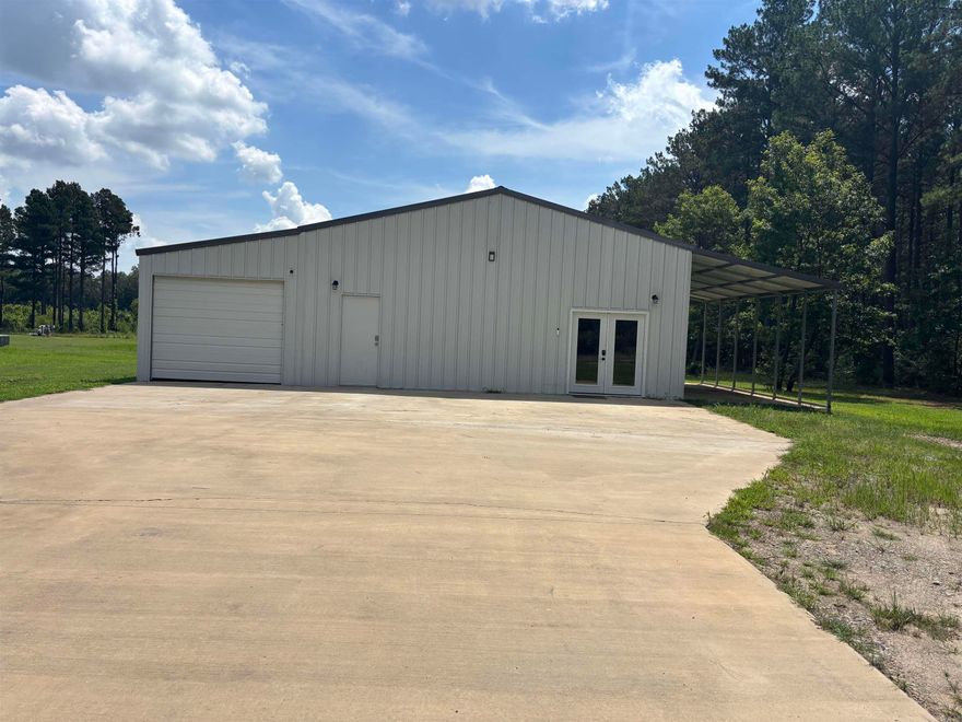 Experience country living just outside of Searcy! This amazing 2022-built barndominium offers the perfect blend of rustic charm and modern luxury on 1 acre of picturesque land. As you enter, you're greeted by the 900 square foot living space adorned with high-end finishes throughout including granite countertops in the kitchen. With the serenity of country living and the convenience of modern amenities, this barndominium offers the best of both worlds. 10 x 30 enclosed garage with 8 x 10 door. 12 x 30 lean to with concrete pad. Don't wait, schedule your showing today!