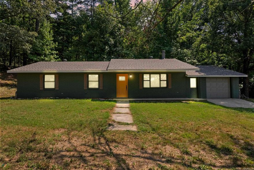 If you are looking for a like-new home with tons of updates in a private Ozark Foothills setting, this is it! Updates include:  New architectural shingle roof, new HVAC unit, new appliances, new vinyl flooring throughout, new granite countertops in kitchen and bathrooms, new backsplash, new paint throughout, new fixtures and pulls, new garage door. This home feels like new! The living room features a gorgeous wood burning fireplace with rock accents. Great use of space in this floor plan. 3 bed/2 bath. Primary bedroom features custom wainscoting that makes the room pop. Storage/workspace area just off the garage. Outside you'll find a front porch, back patio, outbuilding for storage, and tons of privacy. There's even a beautiful view of the Ozarks looking out from the front of the property. Super close to Greers Ferry Lake! Whether you are looking for a full time residence, or a relaxing vacation home with income potential, this property delivers. It's rare to find a home with these high quality upgrades in this price point in this area. Contact your Realtor to set up your private showing today!