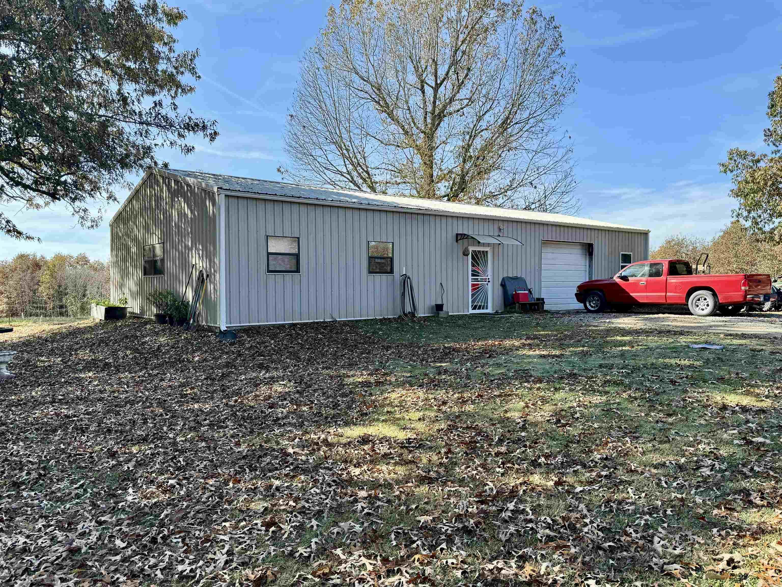 2 Bedroom, 1 bath Barndominium on 10 acres! This property is all fenced and cross fenced with a large stocked pond! The home features a large living area, spacious kitchen, master bedroom with a walk in closet and attached laundry room, formal dining area or office space, guest bedroom, and full bathroom with a walk in shower. There is also an 18x18 one vehicle garage/workshop area! The property is great for a hobby farm with so many possibilities!