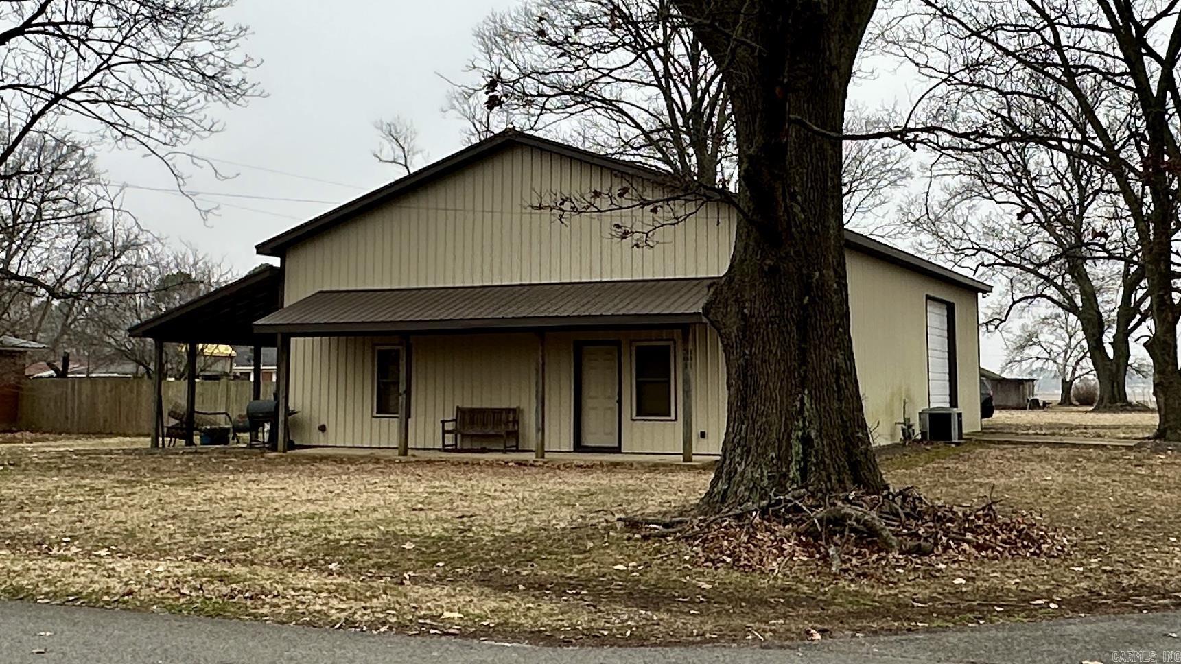 Barndominium Near the Cache River – Tupelo, Arkansas Here’s a unique setup just minutes from the Cache River National Wildlife Refuge — perfect for hunters, outdoorsmen, or anyone looking for a cool place to hang their hat. This barndominium has around 2,400 total square feet and sits on a shaded .65-acre lot under some massive trees. Inside, you’ve got 2 bedrooms, 1 bath, and a safe room that works great for storm season or securing your guns. The living area has stained concrete floors and a laid-back, rustic feel. The attached shop is fully insulated, includes 2 overhead doors, a half bath, and even an extra bedroom upstairs — perfect for guests or gear storage. Bonus: most of the furnishings are staying, so it’s just about move-in ready. Whether you’re looking for a weekend spot, a base camp for duck season, or a low-maintenance country home, this one’s worth a look.