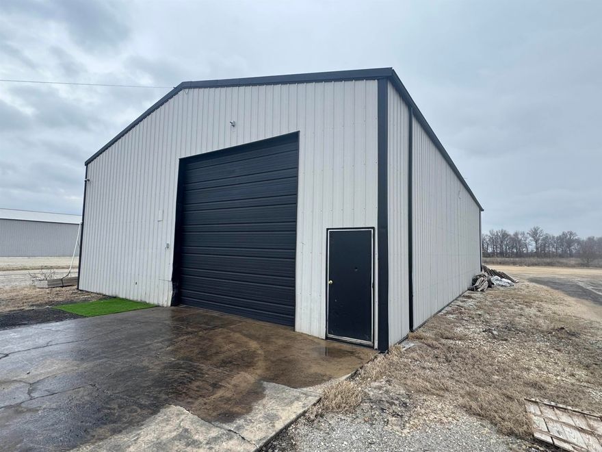 Prime commercial opportunity in Jonesboro AR. Don't miss this versatile 3160 sf light industrial metal shop situated on 1 acre m/l. Designed with functionality and efficiency in mind, this property is ideal for wide range of commercial uses. The building features 2 oversized 14x14 automatic bay doors, providing easy access. The spacious open shop layout offers ample room for operations, storage, or workspace customization. Inside: 2 half baths, for both private and public use; clean  finished office space perfect for daily operations; high ceilings with excellent overhead lighting; concrete flooring. The 1 acre lot provides for ample parking. If you're looking for move in ready industrial space with room to grow your business.