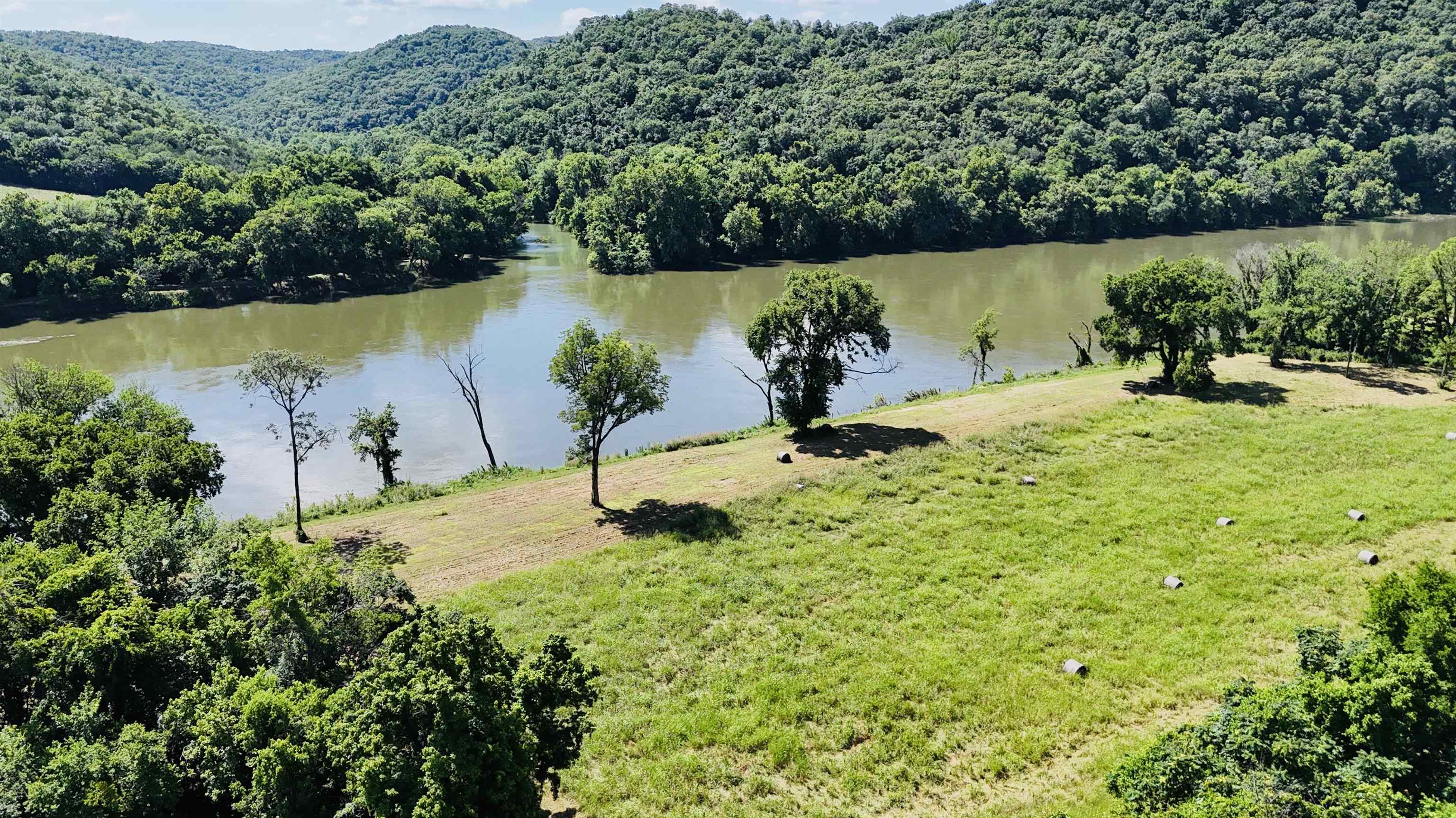 Escape to 1.28 acres of recreational heaven on the White River. This secluded lot sits at the end of a quiet gravel road and features breathtaking bluff views, direct river frontage, and a private boat launch—ideal for fishing, kayaking, and floating. Whether you're looking for a weekend getaway, a peaceful campsite, or a future cabin site, this property offers it all. Plus, fiber internet is available, combining outdoor adventure with modern convenience. A rare find for anyone seeking natural beauty and year-round river enjoyment.