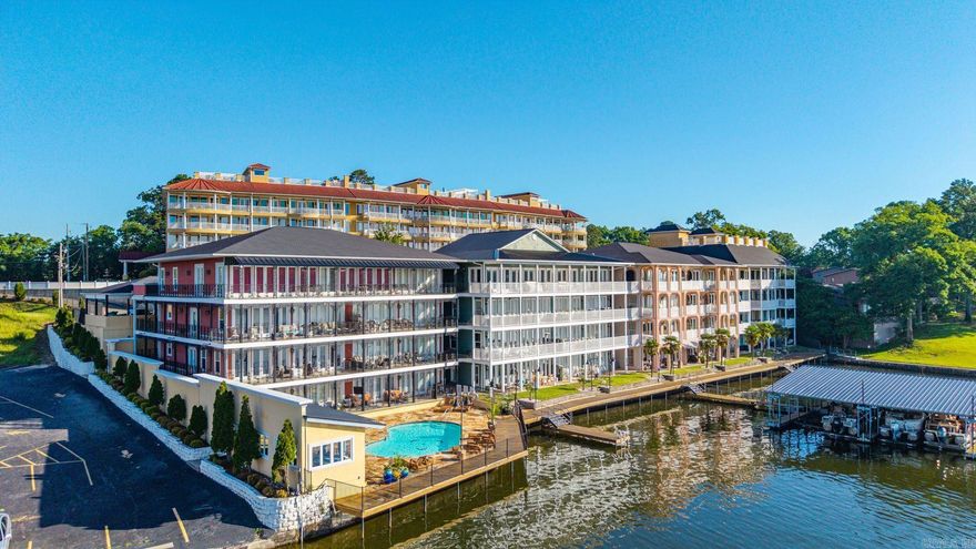 2 bedrooms. 2 baths. 1,662 square feet. Ground floor. Pool outside the back door. Covered boat slip on Lake Hamilton. Some condos make you work for the fun part. Unit 1F does not. At Fiesta Bay, this one-level condo gives you the easy version of lake living: unpack, walk outside, and decide whether the day starts at the pool or on the boat. Inside, there is room to spread out, a fireplace for cooler months, and an open porch that adds real everyday living space. The location off of 7 South is stellar. The condo puts you close to Hot Springs dining, marinas, shopping, medical, Oaklawn, and Bathhouse Row. If you have been looking for a Lake Hamilton place that feels simple, usable, and ready for real life instead of just photos, 1F deserves a look.