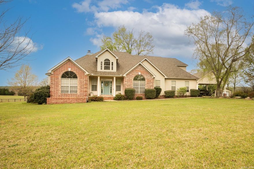Welcome to 125 Ford Drive, situated on 10.97 acres with fencing in place for horses. This 4 bedroom, 3 bathroom home offers a functional layout with both indoor and outdoor living spaces. The entryway opens to a spacious living room featuring a gas fireplace, which flows into a sitting area highlighted by a large window overlooking the back of the property. The home includes a formal dining room and an eat-in kitchen with ample cabinet storage and a breakfast bar. The primary suite offers a generously sized bedroom, double sink vanities, a dedicated vanity area, walk-in shower, corner tub, and a large closet. A sizable laundry room adds convenience. Upstairs includes a bonus room, additional bedroom, and full bath. Outdoor features include a barn, carport, storage building, screened-in porch, and an open back porch that leads to the backyard. Don't miss out on the opportunity to make this unique property yours, call today to tour!