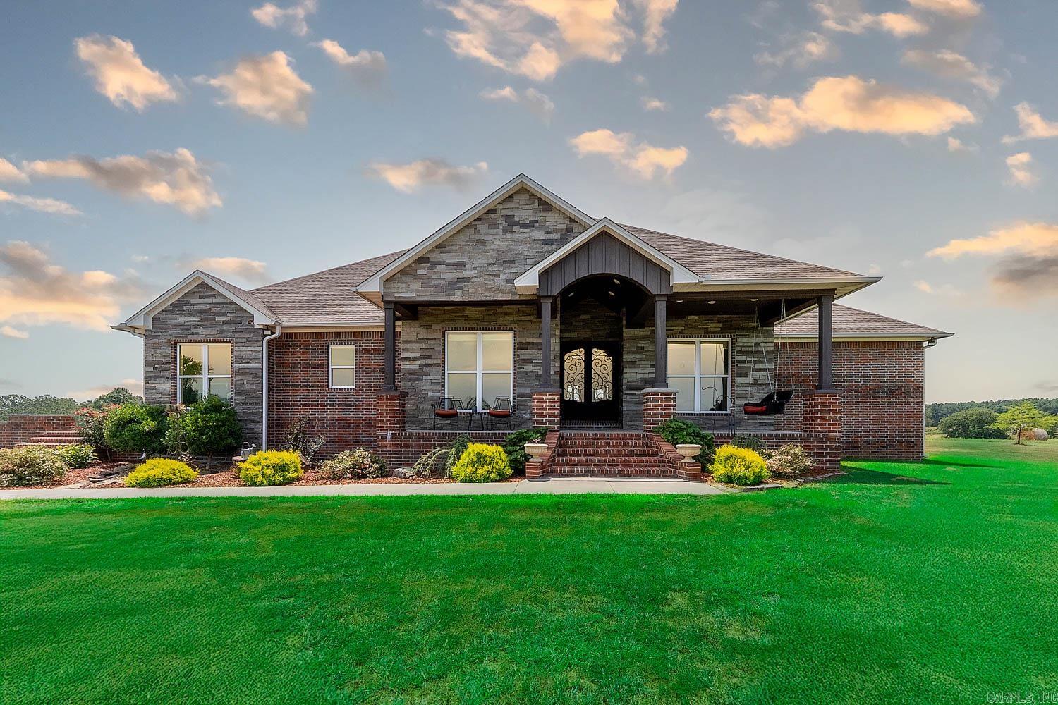 Custom Home on 96 Acres in Hector, Arkansas – Built in 2020 Experience modern country living on 96 beautiful acres with this 3,485 sq ft custom home in Hector, AR. Built in 2020, it offers a spacious layout, high-end finishes, and thoughtful design throughout. The open-concept living area features a custom entertainment center, while the kitchen shines with granite countertops, custom cabinets, and a walk-in pantry. The home includes 4 bedrooms and 3 baths with quartz counters and walk-in showers. The master suite features a large walk-in closet and spa-like bath. A private mother-in-law suite and an entertainment room add flexibility. The home is fully wheelchair accessible and includes a heated/cooled 2-car garage. Outdoors, enjoy a covered porch, level yard, mature landscaping, cattle-tight fencing, and a scenic pond. High-speed fiber internet keeps you connected. Choose from 40, 76, or all 96 acres—including fields, woods, and a second pond. Just minutes from the Ozark National Forest, Illinois Bayou, and Russellville.