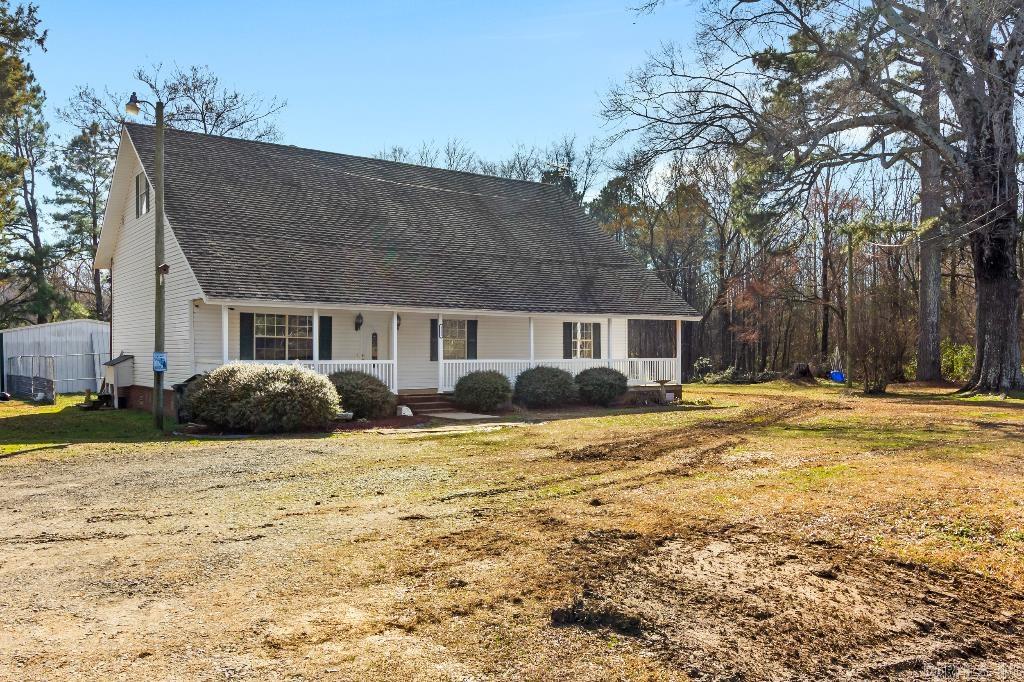 5 bed, 3 bath on .87 acresāperfect for a growing household! Covered front/back porches for year-round outdoor fun. Main level offers 3 beds incl. primary suite, wood-burning stove & friendly layout. Upstairs: 2 beds & full bath for added space. 24x32 shop is ideal for projects/storage. Roof to be replaced before closing. A rare find!