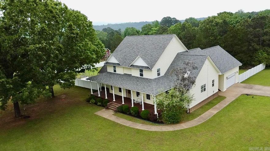 Spacious and inviting, this home welcomes you with a warm foyer and offers a functional layout designed for everyday living and entertaining. Enjoy both a formal dining room and an eat-in kitchen featuring vaulted ceilings, custom cabinetry, and a pantry. With six bedrooms and 4.5 baths, there’s plenty of flexibility for a game room, craft area, or additional living space.  The large living room is centered around a gas fireplace with built-in bookcases, while a dedicated office provides an ideal work-from-home setup. The expansive ensuite features double closets, a jetted tub, walk-in shower, and radiant heat for added comfort. Additional highlights include a spacious laundry room, tankless water heaters, abundant attic storage, and a Jack-and-Jill bath for secondary bedrooms.Step outside to enjoy a huge covered front porch and a rear sun deck, all just minutes from Lake Ludwig. The fenced yard also includes a chicken coop and garden area, offering both charm and functionality. Major updates include a roof in 2022, HVAC systems in 2025–2026, and a gas cooktop in 2025.