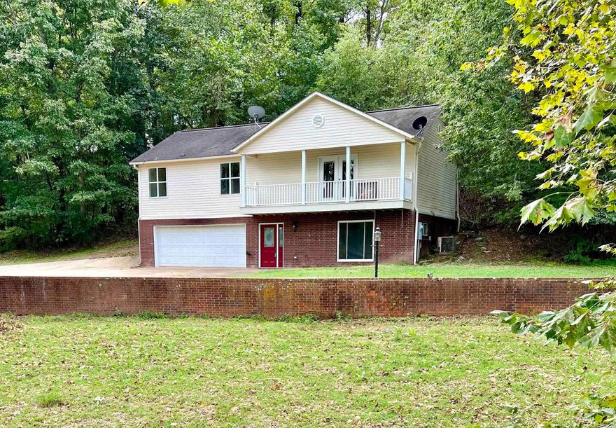Within close proximity to the walk-in access and fishing bridge at Hwy 110, Little Red River. 3 bedroom, 2 bath, brick and vinyl siding, split level home, 1930 square feet. This spacious home offers a nice setting in the hillside overlooking the river bridge, walk to the fishing bridge access which can be seen from the front of the house. Sit on the back deck and view the wooded hillside in privacy. Recently updated, all new paint, flooring, deck, some new fixtures. The main floor offers a laundry room, full bath and 4th bedroom option, or it could also be utilized as an office, craftroom, additional living area or gameroom. 3 bedrooms, ensuite bathroom, kitchen, dining and living are on the second level with a nice balcony overlooking the pasture land across the highway. You will love the beautiful surroundings, ease of access to the river as well as the convenience to Greers Ferry Lake (approximately 20 minutes).