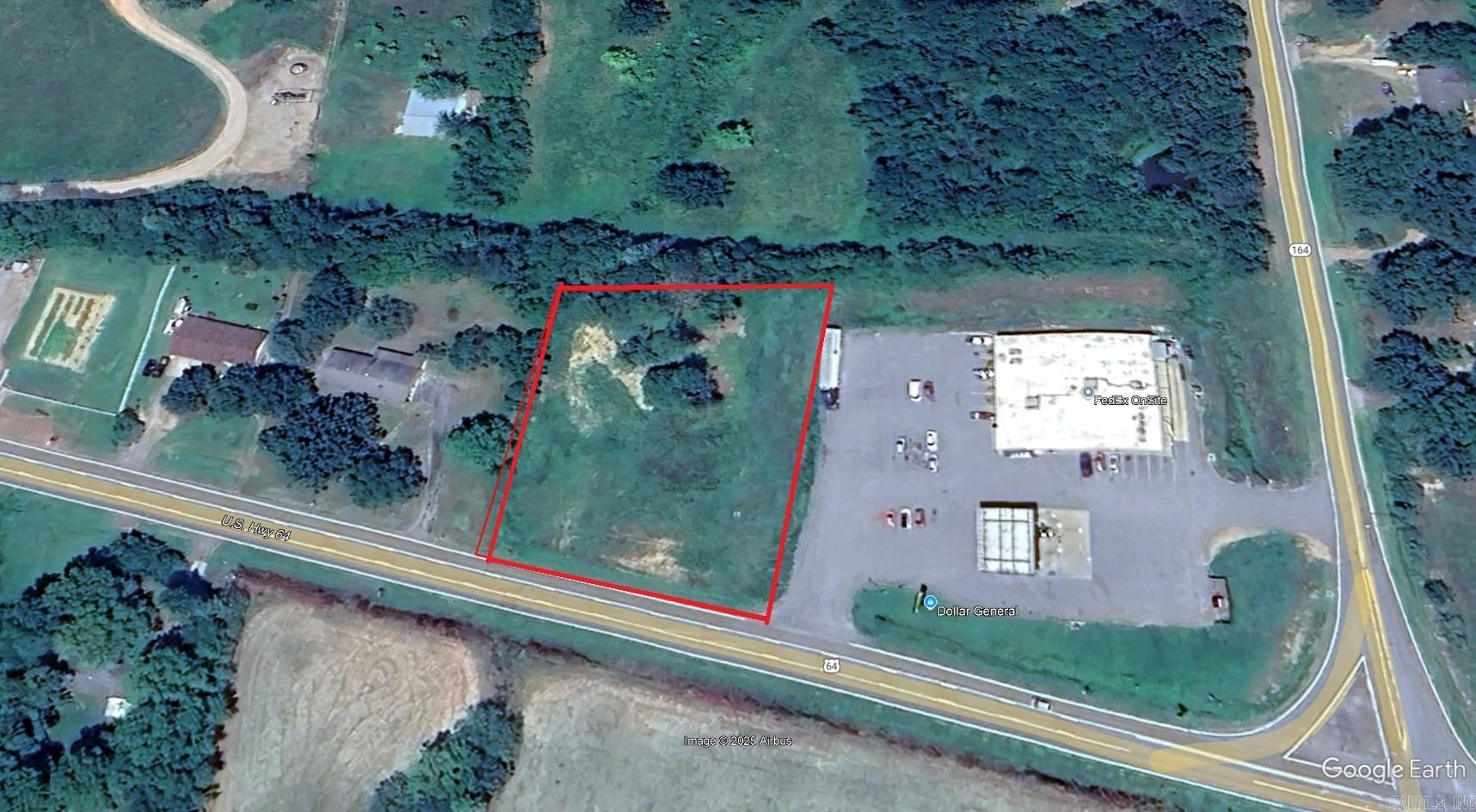 NICE MOSTLY LEVEL LOT JUST NEXT TO THE DOLLAR GENERAL STORE & GAS STATION ON ITS WEST SIDE. APPROX 210 FEET OF HIGHWAY #64/MAIN STREET FRONTAGE. MOST UTILITIES SHOULD BE AVAILABLE. NATURAL GAS ONSITE. HIGH TRAFFIC AREA IN THE COAL HILL CITY LIMITS NOT FAR FROM J.C. WESTSIDE SCHOOL, CITY HALL, AND 3 MILES FROM THE JOHNSON-FRANKLIN COUNTY LINE. COULD BE COMMERCIAL OR RESIDENTIAL DUE TO COAL HILL NOT HAVING CITY ZONING REGS. WOULD MAKE A GREAT FAST FOOD RESTAURANT LOCATION!
