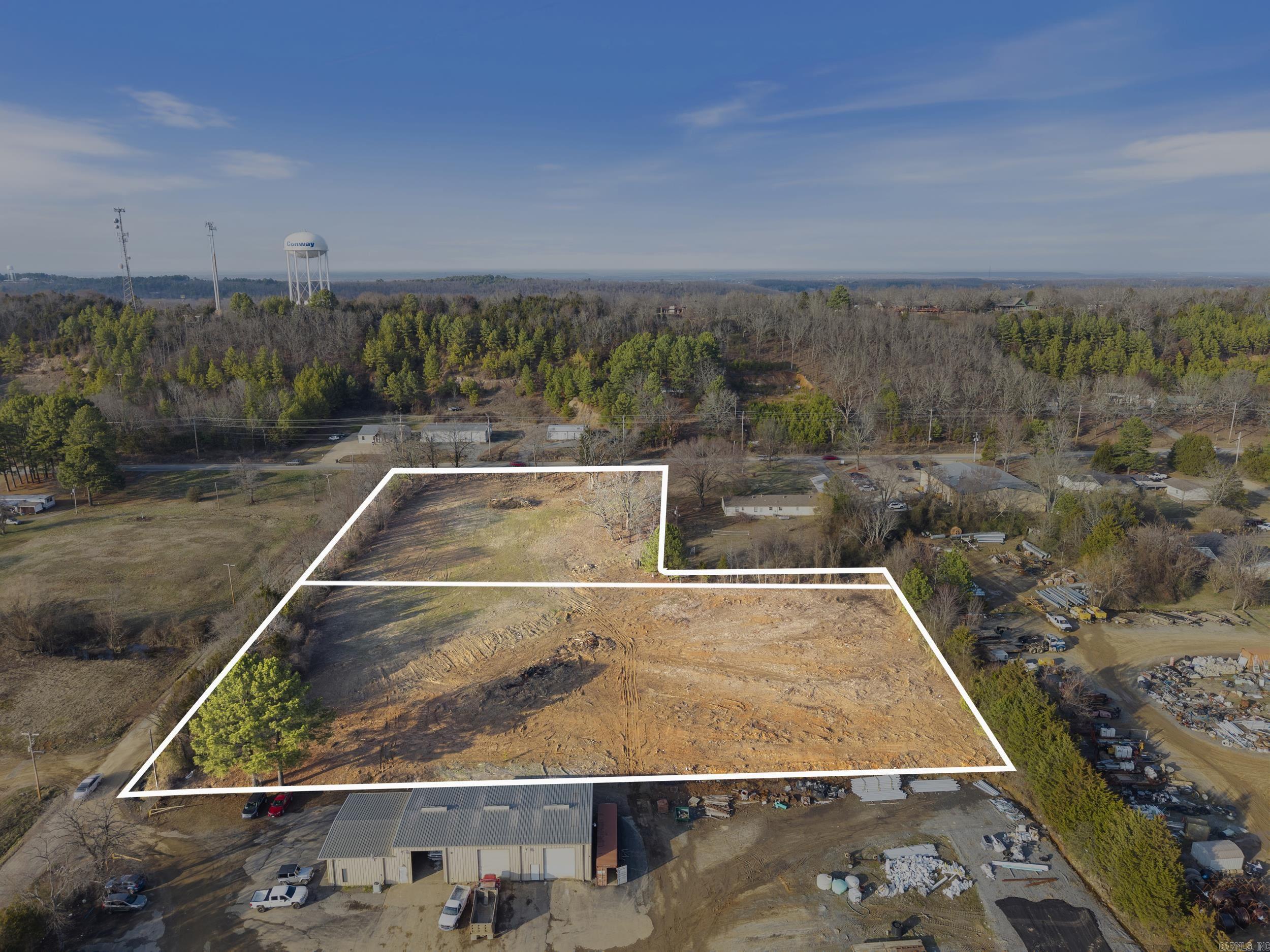 Prime Commercial Opportunity – 3.98 Acres in city limits with Lower Ridge Rd Frontage! Seize this exceptional commercial property located in a high-visibility, high-traffic area with 8,500 cars passing daily! Situated on 3.98 acres on 2 lots in city limits! This versatile property offers endless possibilities for retail, restaurant, office, service-based businesses or multi-family. Strategically positioned in a rapidly growing area, recent city road enhancements—including a new cut-through to Highway 65 and Skyline Drive—provide seamless access and increased exposure. Whether you're an investor or business owner, this property is a prime location for success! Don’t miss out on this rare opportunity to establish your business in a thriving corridor!
